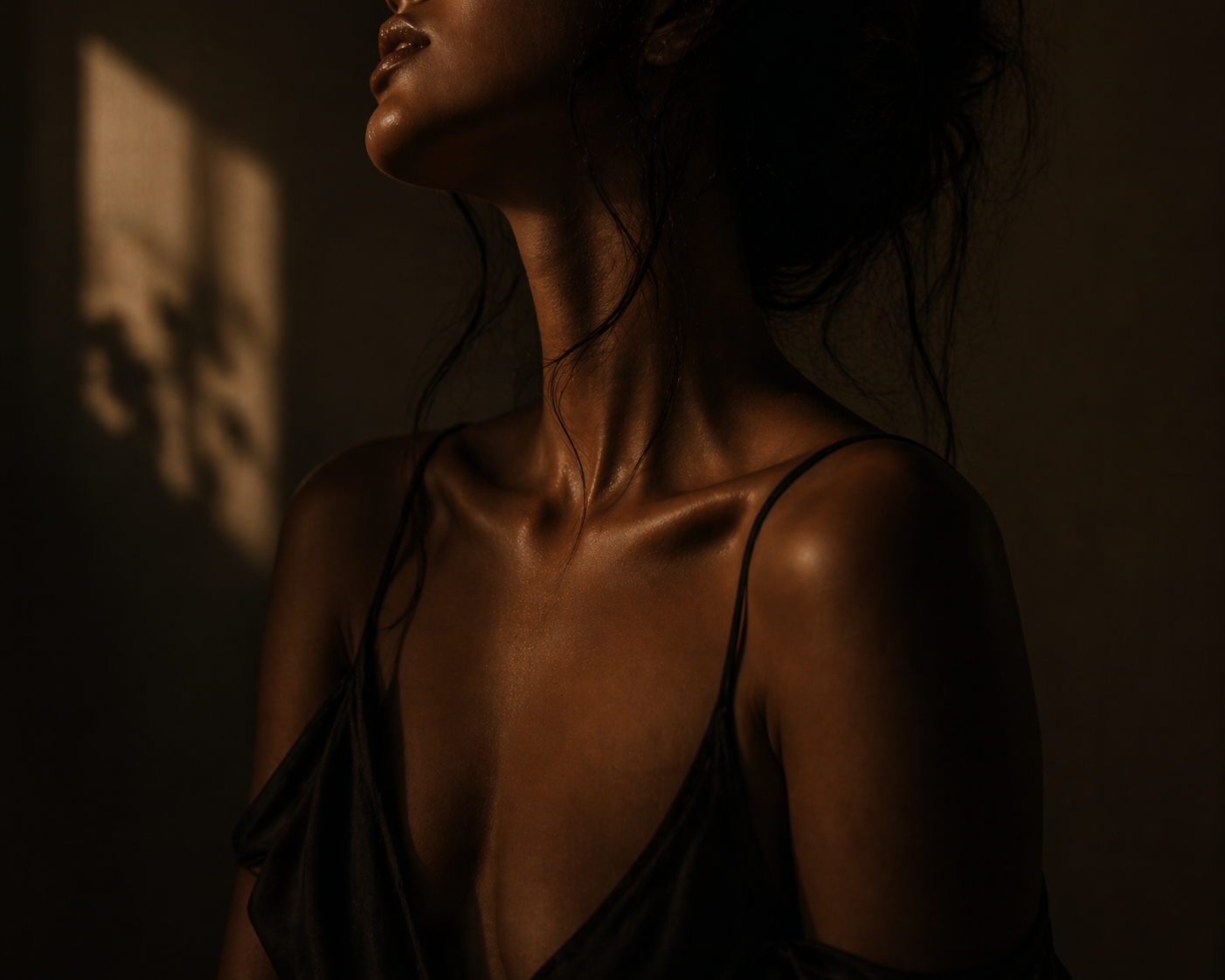 A figure caught in a column of warm window light